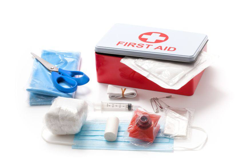 A first aid kit with other tools and masks