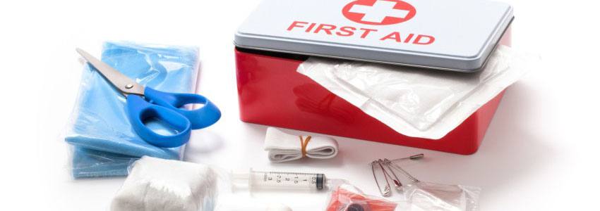 A first aid kit with other tools and masks