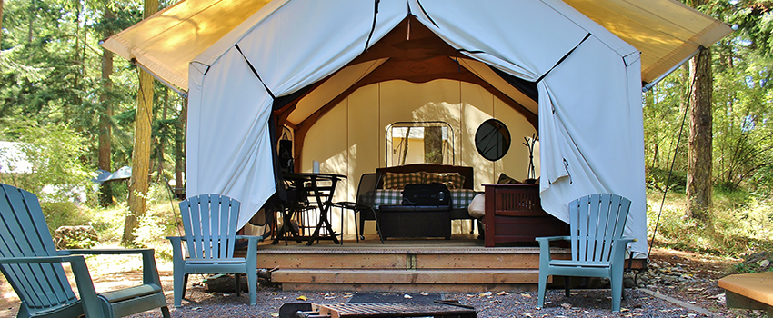 A big camping tent in the woods
