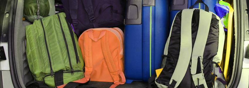 The back of a car filled with luggage