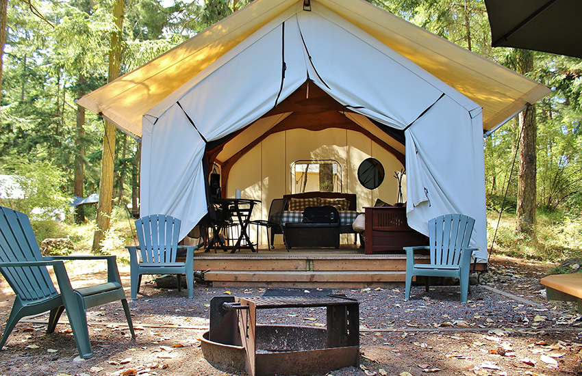 A big camping tent in the woods