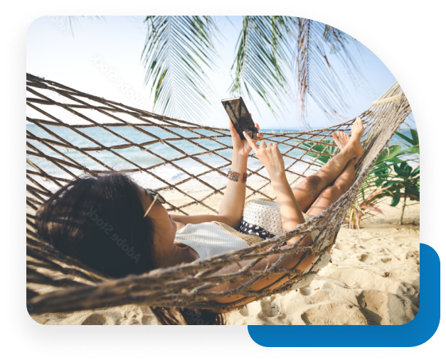Woman sitting on a couch watching the Blue Cross Customer Space on her cell phone.