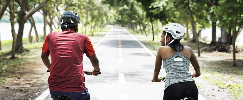 Couple cycling on a trail