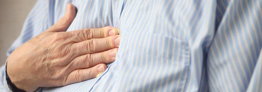 A person pressing on their chest with their hand