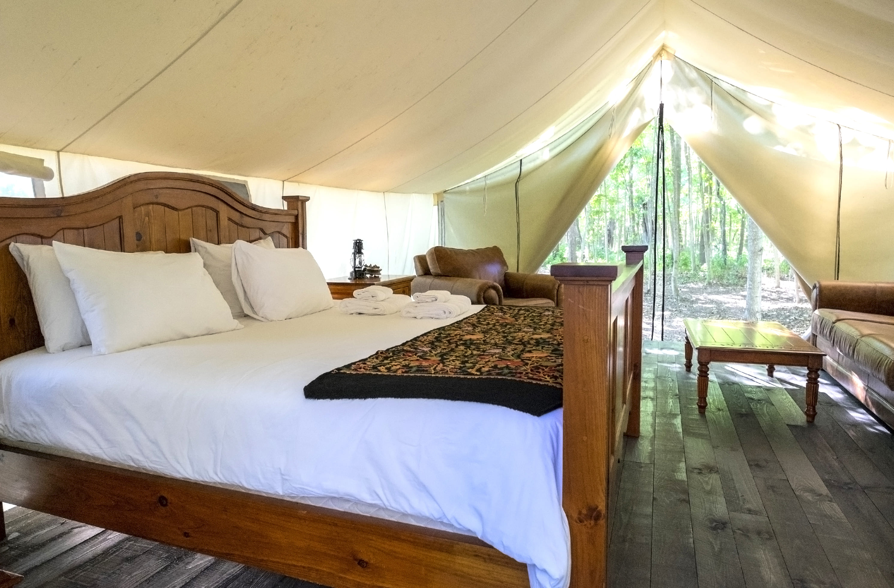 Luxurious furniture in a glamping tent in the woods