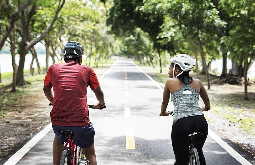 Couple cycling on a trail