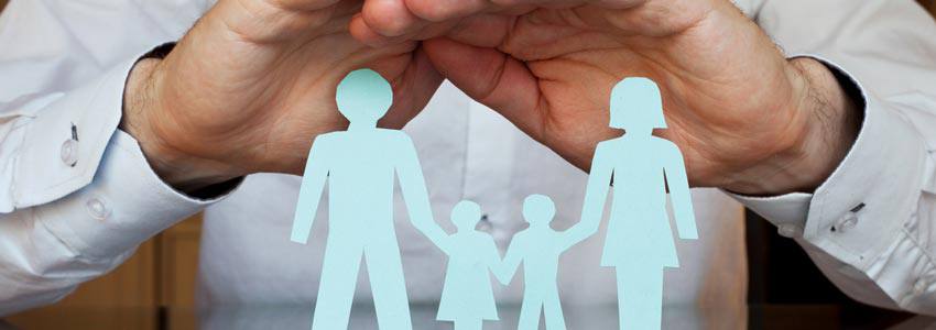 A paper cutout of a family holding hands