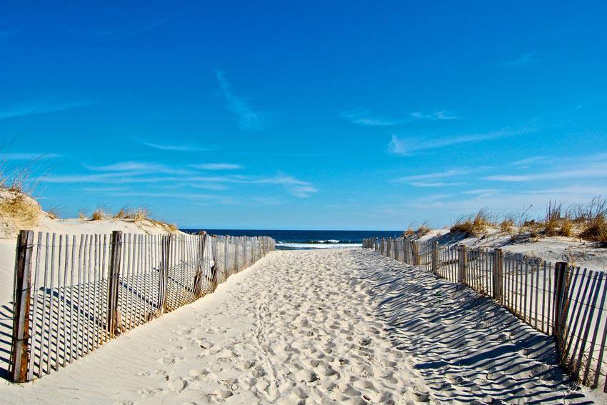 A closed path on the sand leading to the beach