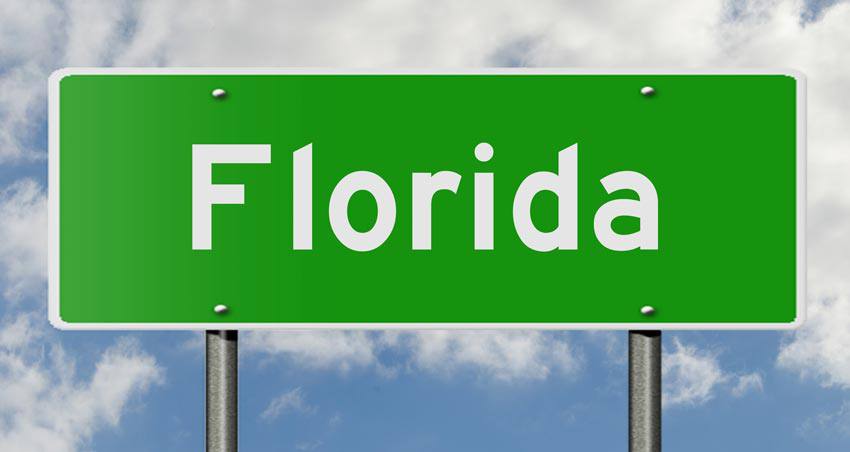 A green street sign written "FLORIDA" on it