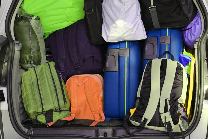 The back of a car filled with luggage