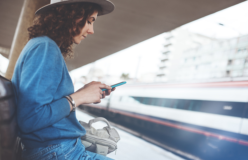 A woman looks at her phone
