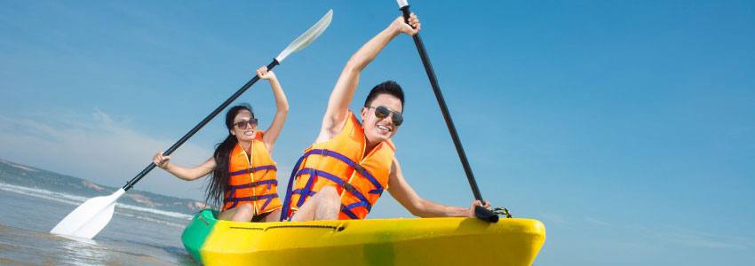 Two people kayaking in the ocean