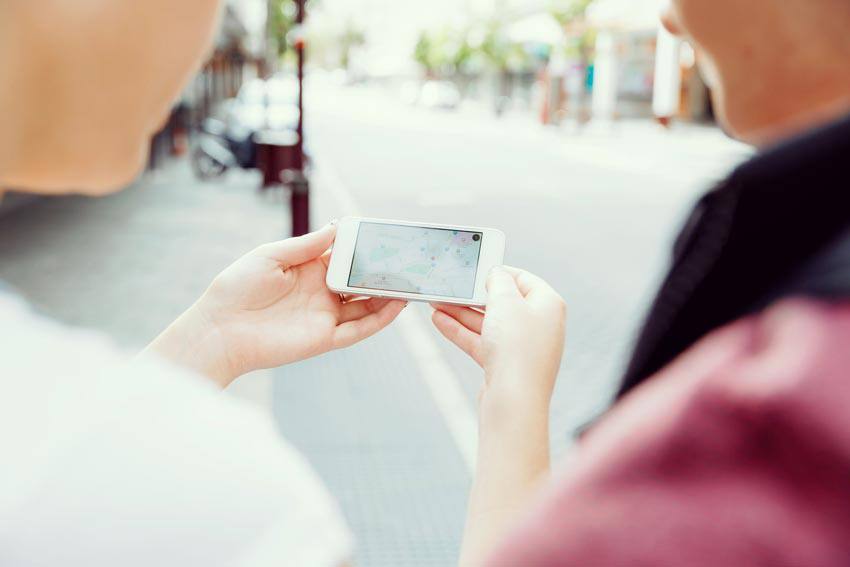 Two people watching a video on a phone