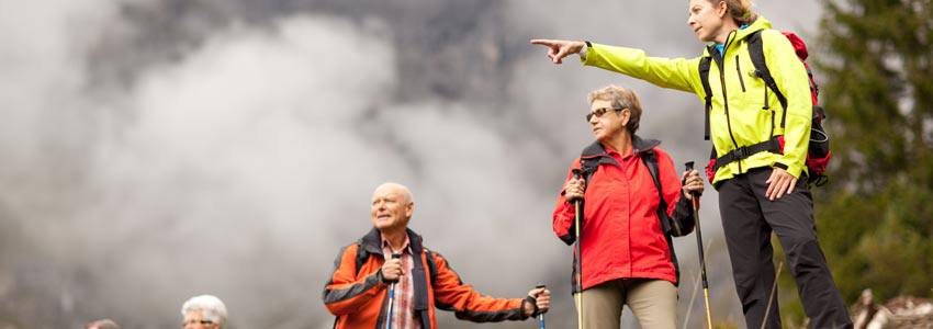 Group of elderly people hiking in the mountain